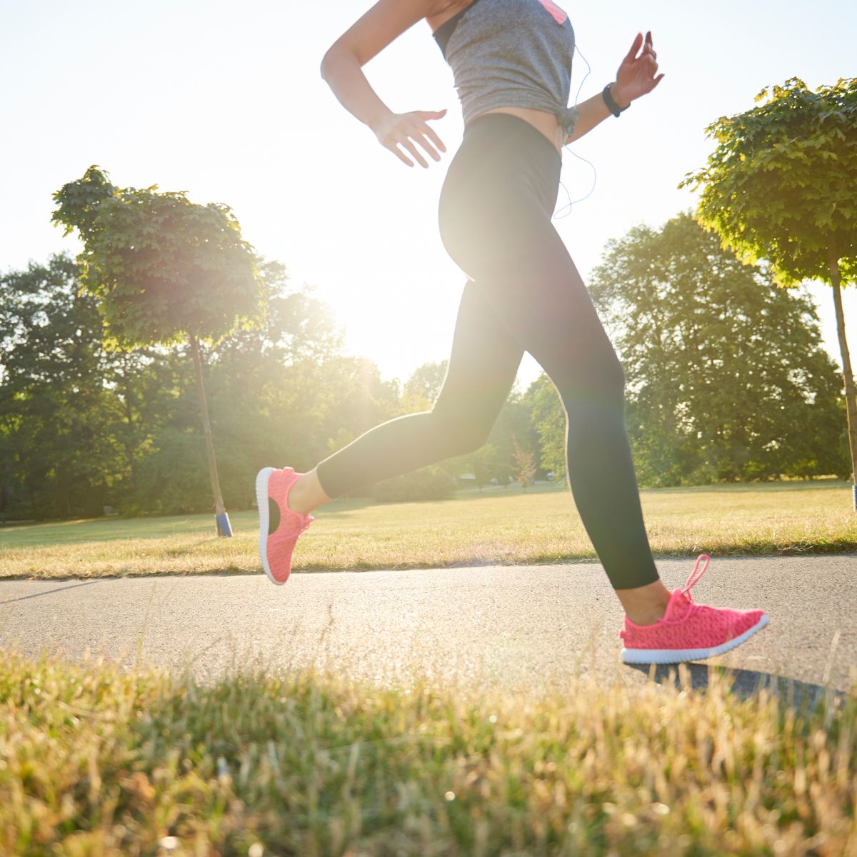 A woman running after taking vitamin C to support exercise